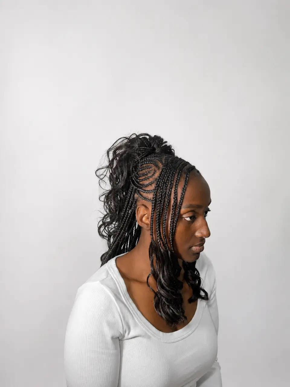 Curly braided ponytail with sculpted side pattern